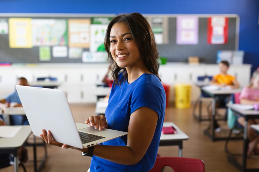 Teacher holding a laptop